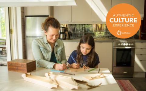 Mother and daughter are planning to decorate a kantele.